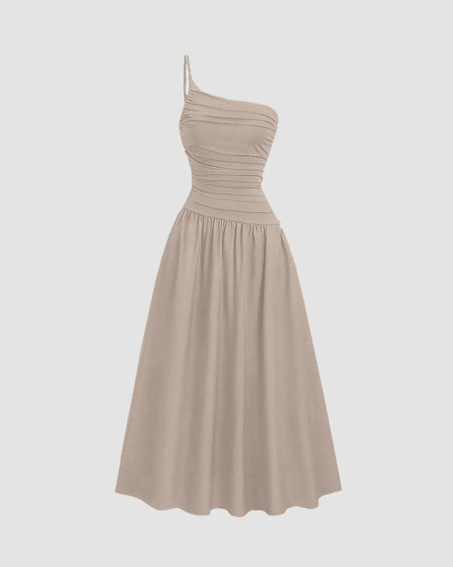 Front view of Beige asymmetrical neck midi dress with long flared dress with sleeveless look perfect for a vacation