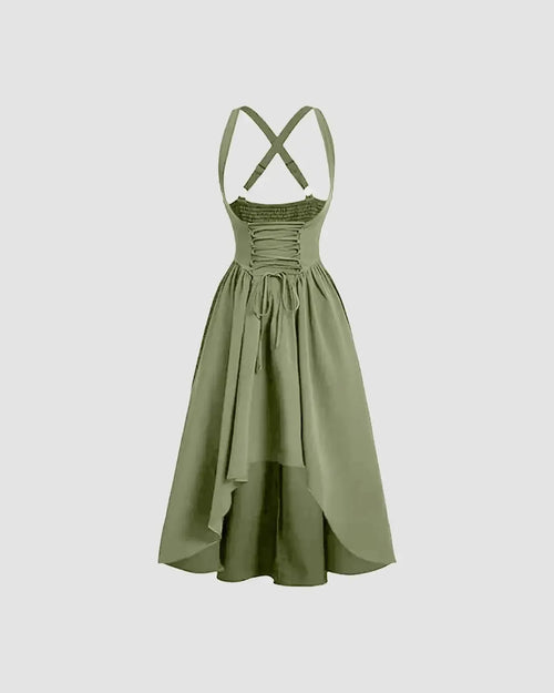 Backless strappy long dress in herbal green, featuring delicate straps and a flowing silhouette.