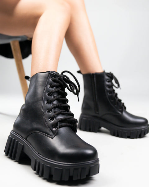 Women wearing Black Knee High Boots with Chunky Low Heel