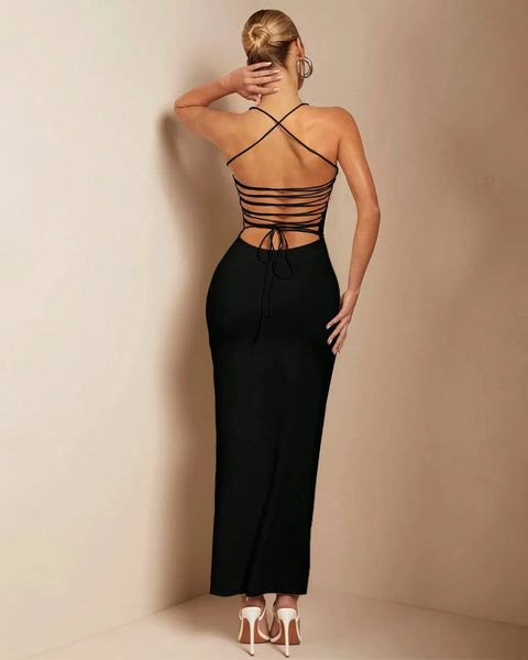 Woman's back view in a black strapless bodycon maxi dress, highlighting the elegant design and fitted style.