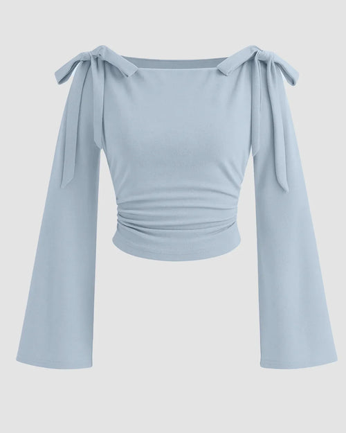 Front view of Bow tie shoulder crop top with soft stretch fabric, long flared sleeves, and a flattering fitted silhouette
