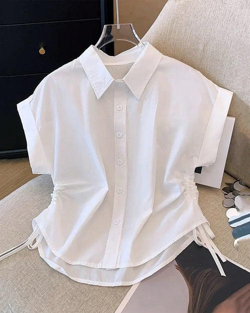 Front view of White button down shirt with classic collar, short sleeves and lightweight fabric, styled neatly on hanger for casual wear