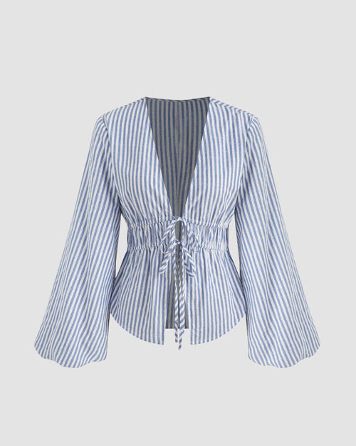 Front view of Blue and white striped top with long sleeves and a V-neck, featuring a knotted and shirred design