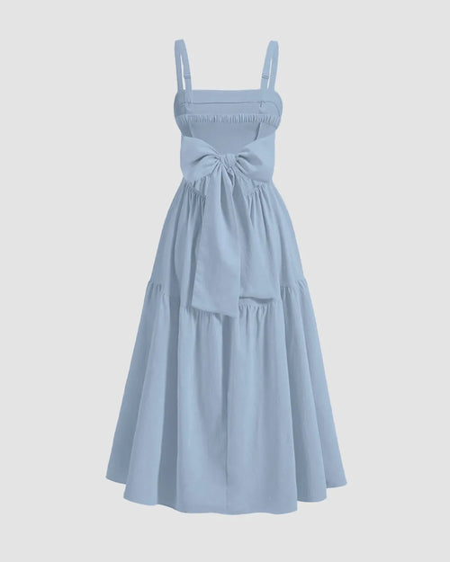 Chic tiered midi dress in English blue, featuring a stylish back bow and a flared silhouette.