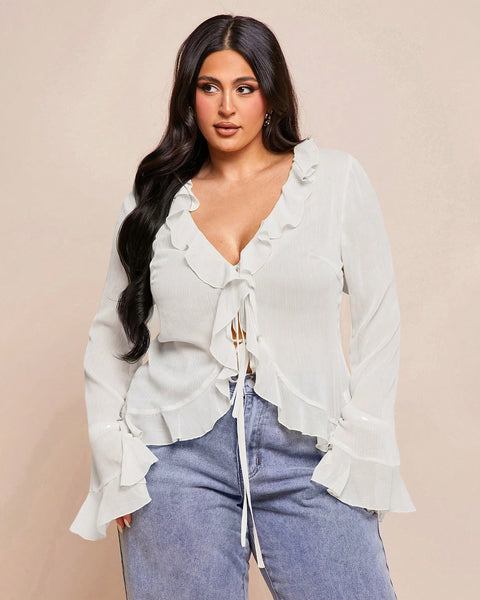 Front view of plus size white tops with chiffon fabric, ruffle frill detail and full sleeves for a flowy feminine look.