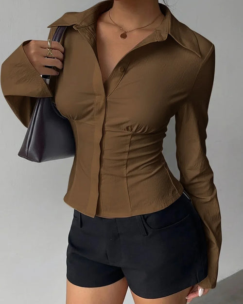 Women wearing brown collared v neck shirt with ruched waist and slim fit silhouette, stylish plain brown shirt.