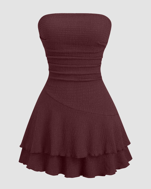 Front view of girls maroon dress with crinkle texture, ruched bandeau design and layered ruffle hem mini silhouette.