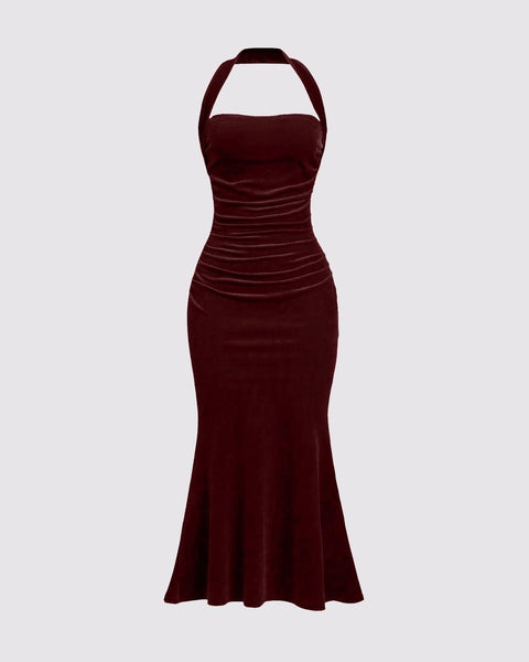 Front view of Deep red velvet halter bodycon maxi dress with ruched waist and flared hem, shown front and back silhouette.