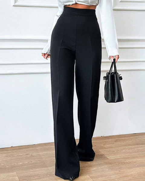 Front View of Black wide leg pants with high waist, smooth fabric, straight fall, and full length fit styled for casual wear everyday.