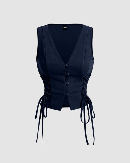 Front view of Navy blue sleeveless crop tank top with cross tie straps and side straps, V-neckline and a curved hem.