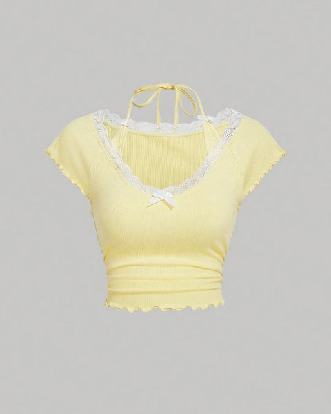 Front view of Vanilla tie neck top with lace trim and halter neckline, featuring a fitted bodice and soft pastel finish.