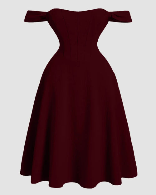 Front view of Maroon one shoulder romantic dress with faux fishbone design and flared skirt, featuring a structured elegant silhouette