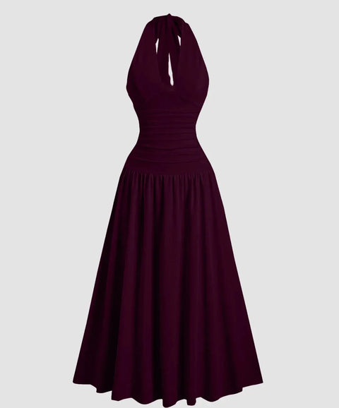 Front view of Flared maxi dress with halter neckline and flowy skirt, featuring a fitted bodice and elegant drape in a studio product view