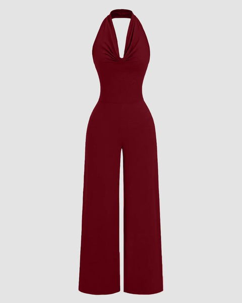 Maroon halter cowl neck jumpsuit with wide legs, made from stretchy fabric for a comfortable fit.