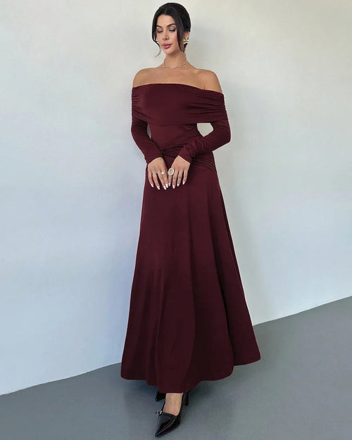 Front view of Maroon off-shoulder maxi dress with ruched waist, A-line skirt and twist detail, featuring an elegant flowy silhouette