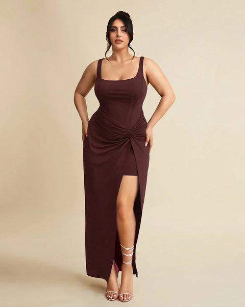 Front view of Plus size maroon maxi dress with wrap front corset-style bodice, thigh-high slit, and flattering fit for evening wear.