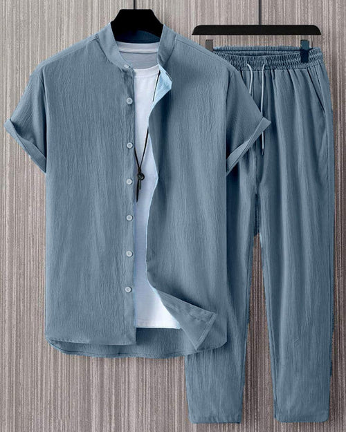 Front view of Blue short sleeve shirt and pants set for men with button front shirt, elastic waist trousers, and casual summer style.