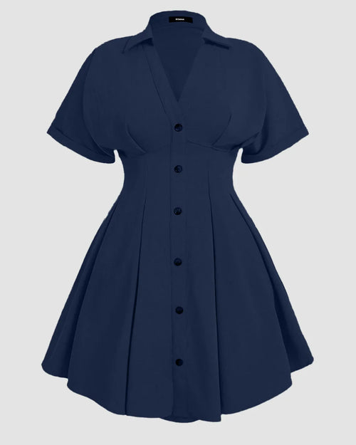 Front view of plus size a line dress in navy blue with collared button down front, pleated skirt and flared mini silhouette.
