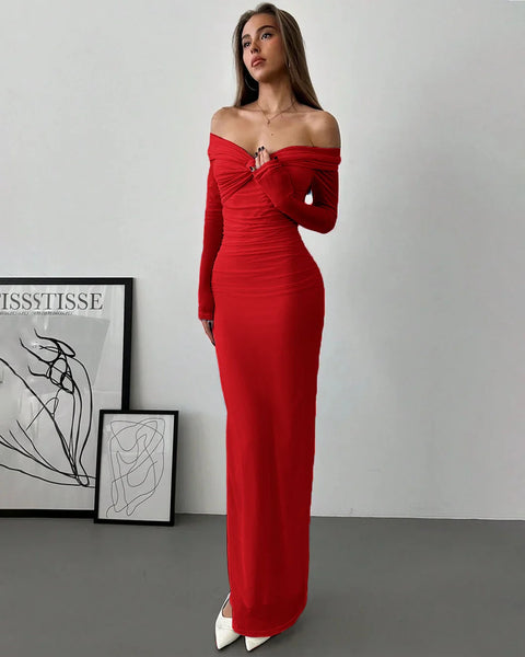 Front view of a woman in red off-shoulder long sleeve mesh maxi dress with ruched bodice and floor-length silhouette.