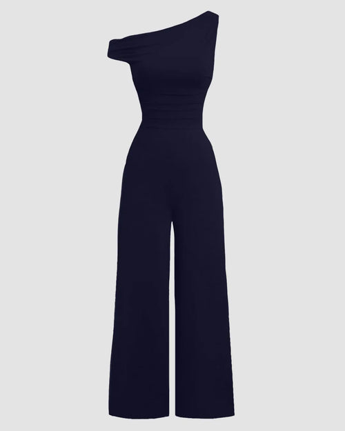Front view of Dark navy one-shoulder wide-leg jumpsuit with fitted waist and clean silhouette on plain studio background.
