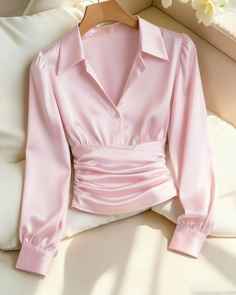 Front view of Pink satin shirt with collared neckline, long sleeves and ruched waist detail, featuring a soft sheen and tailored fit