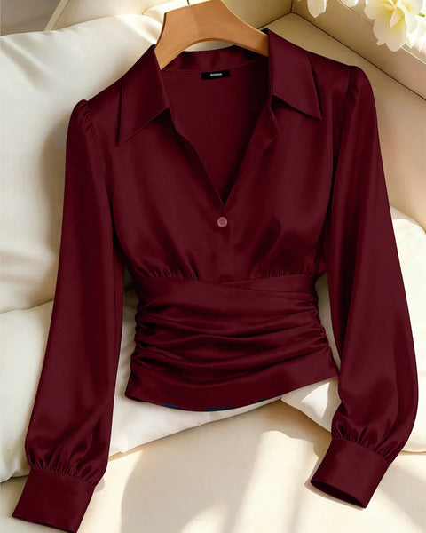 Front view of Red collar neck top with V-neckline, long sleeves and ruched waist detail, featuring a fitted and flattering silhouette