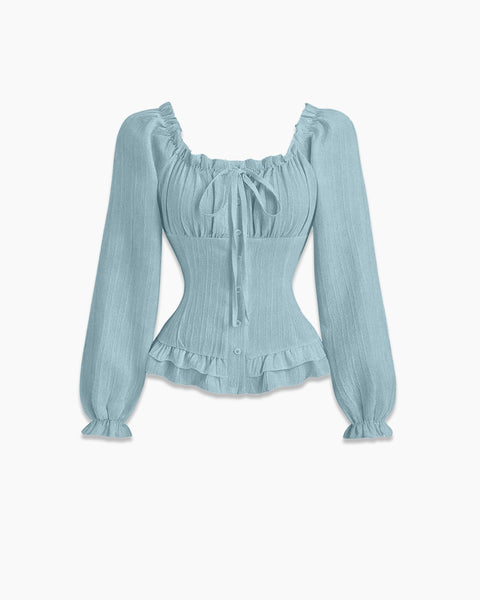 Front view of powder blue top with ruffle frill trim, full sleeves and ruched fitted silhouette for a soft look.