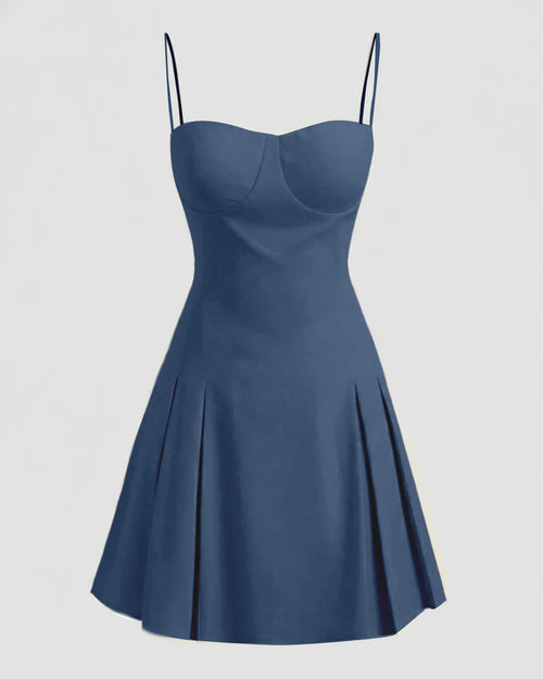 Front view of navy blue mini dress with slim fit bodice, spaghetti straps and a-line flared skirt silhouette.