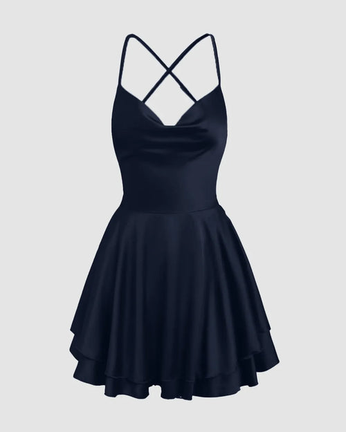 Dark blue spaghetti strap dress with a cowl neck and cross design, featuring a backless boho style.