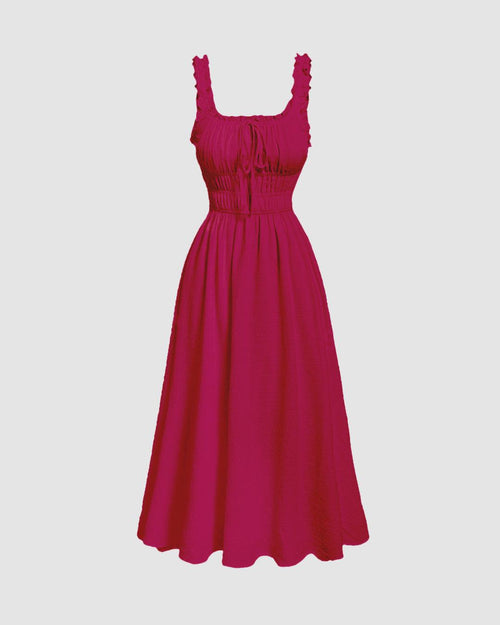 Front view of hot pink color dress with frill trim, tie front detail and sleeveless flared silhouette for a vibrant look.