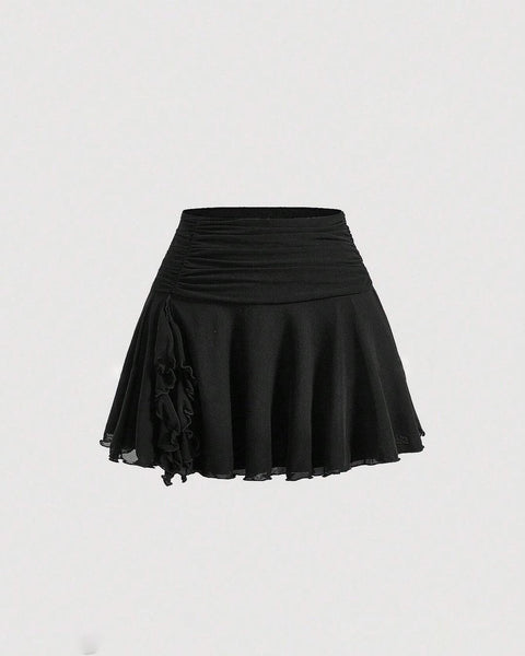 Front view of Short black skirt with ruched waistband, flared hem, and lightweight fabric for a playful casual look.