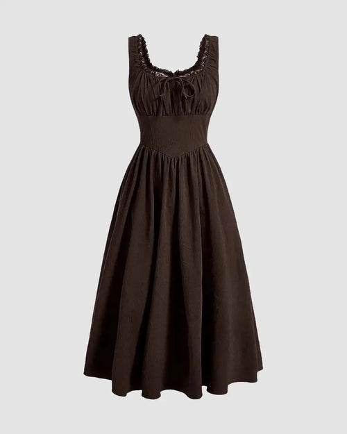 Brown dress with ruffles at the neck, featuring a ruched bust design in a chocolate fondae color