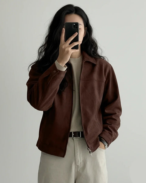 Front view of Brown suede jacket with button front closure, collared neckline, long sleeves, and relaxed fit styled for casual everyday wear.