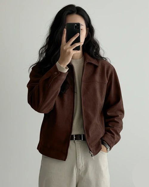 Front view of Brown suede jacket with button front closure, collared neckline, long sleeves, and relaxed fit styled for casual everyday wear.
