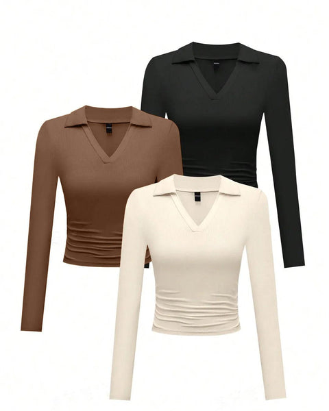 Set of three long-sleeved V-collar tops for women in different colors displayed together