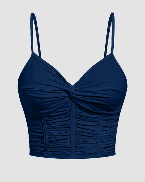 Front view of v neck crop top in navy blue with twist front and ruched detailing, featuring thin straps and a fitted flattering silhouette