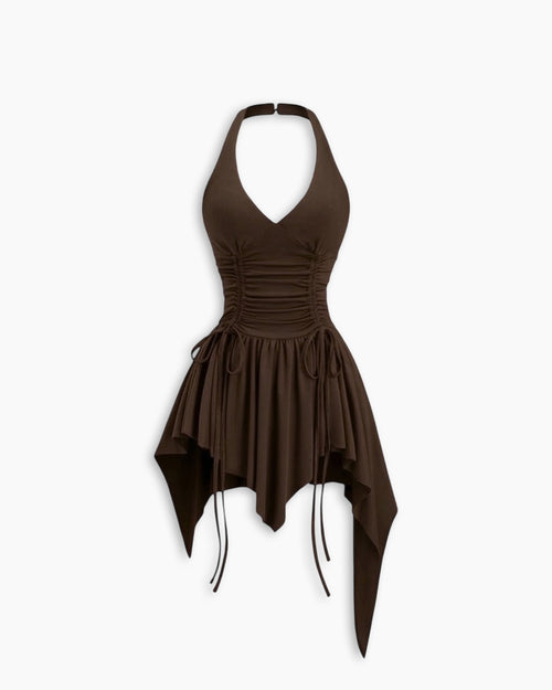 Front view of brown mini dress with halter neck, cinched waist and asymmetric hem for a stylish edgy look.