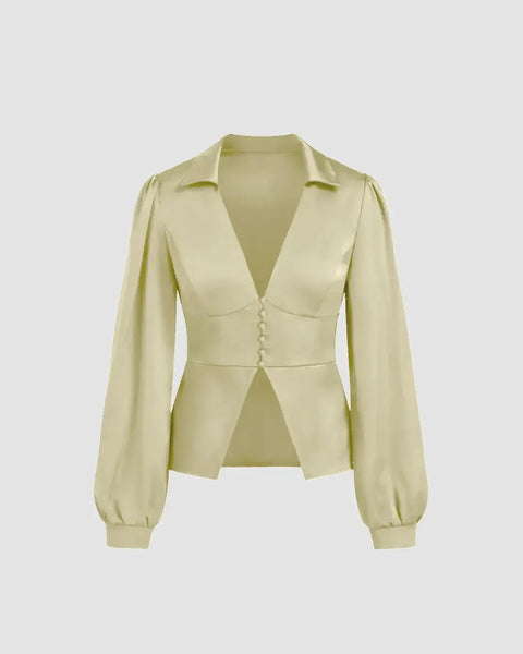 V-neck light gold long sleeve blouse with a split hem and tailored waist for a sleek, structured silhouette.