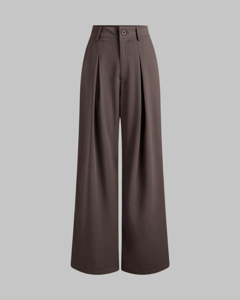 Front view of Brown baggy pants with high waist, pleated front, wide legs, and smooth fabric for a relaxed full length fit.