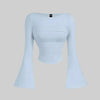Light blue boat neck top featuring a ruched waist and flowing bell sleeves, creating a soft yet structured silhouette.