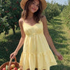 Spaghetti Strap Deep V-Neck Flowy Mini Dress in Pastel Yellow