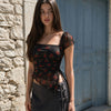 Tie Front Asymmetrical Hem Sleeveless Floral Top in Classic Black