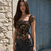 Tie Front Asymmetrical Hem Sleeveless Printed Top in Classic Black