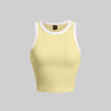 A Vanilla Ribbed Tank Top with White Trim, featuring a ribbed texture and contrast trim for a sleek, structured look.