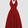 Front view of Red polka dot halter neck A-line midi dress with fitted waist and flared skirt, displayed on a plain background
