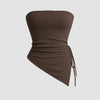 brown strapless top featuring an angled hemline and side ruching, designed for a sleek and stylish look