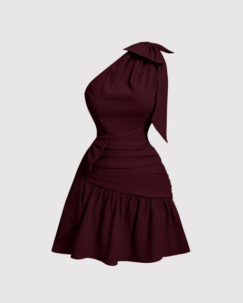 Front view of maroon one shoulder mini dress with bow tie neck, ruched waist and flared hem, stylish one side shoulder dress.