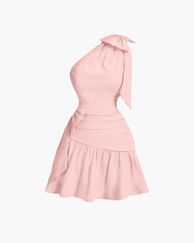 Powder pink mini dress featuring an asymmetrical neckline, bow-tie detail, and a cropped waist for a bold, sculpted silhouette.