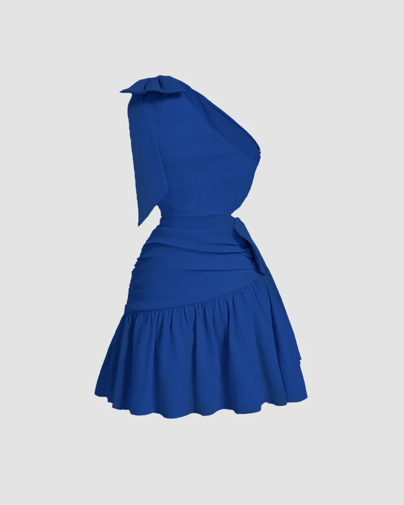 Back view of Surf blue mini dress with an asymmetrical neck and a bow tie detail at the front, featuring a cropped waist design.
