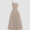 Beige asymmetrical neck midi dress with long flared dress with sleeveless look perfect for a vacation